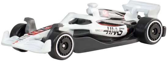 Wit-zwarte Hot Wheels Haas F1-speelgoedauto met zwarte racewielen.