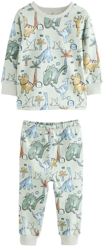 Lichtgroene pyjamaset met all-over dinosaurus- en palmboomprint, inclusief boorden.