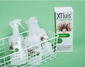 Korf met drie flacons XTluis Protect & Go spray en een doos ernaast.