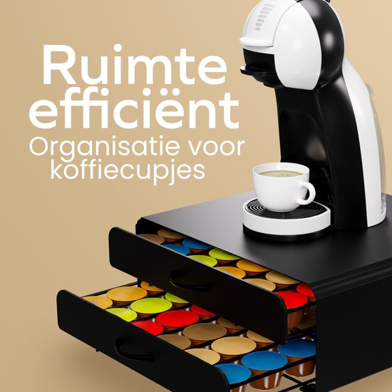 Porte-capsules noir avec 2 tiroirs ouverts remplis de capsules de café colorées, avec une machine à café.