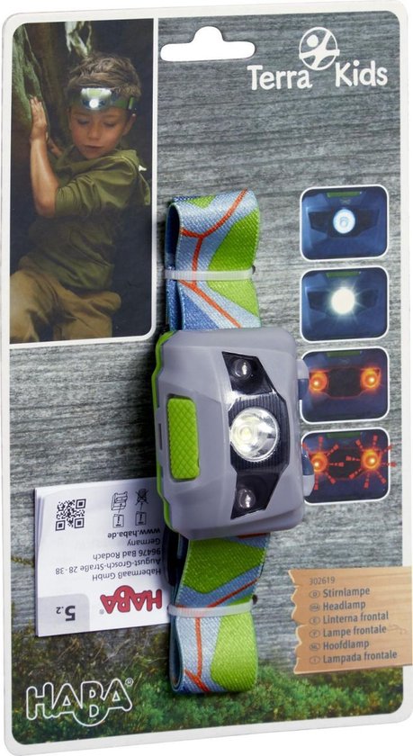 Grijze hoofdlamp met groene accenten op een verpakking met grafische afbeeldingen.