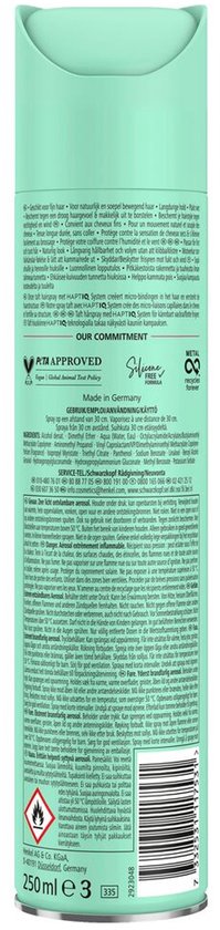 Achterkant van een mintgroene spuitbus Taft Volume haarspray met productinformatie.