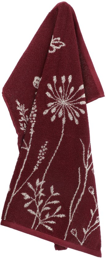 Torchons bordeaux avec impression de fleurs et de plantes blanches. Drappé suspendu.
