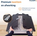 Binnenkant van de zwarte PuzzlePro puzzelmap, met twee sorteerplaten en een puzzelmat met een landschapspuzzel.