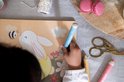 Kleurboek met illustraties van een konijn, bij, lieveheersbeestje, libelle en een meisje in de natuur.