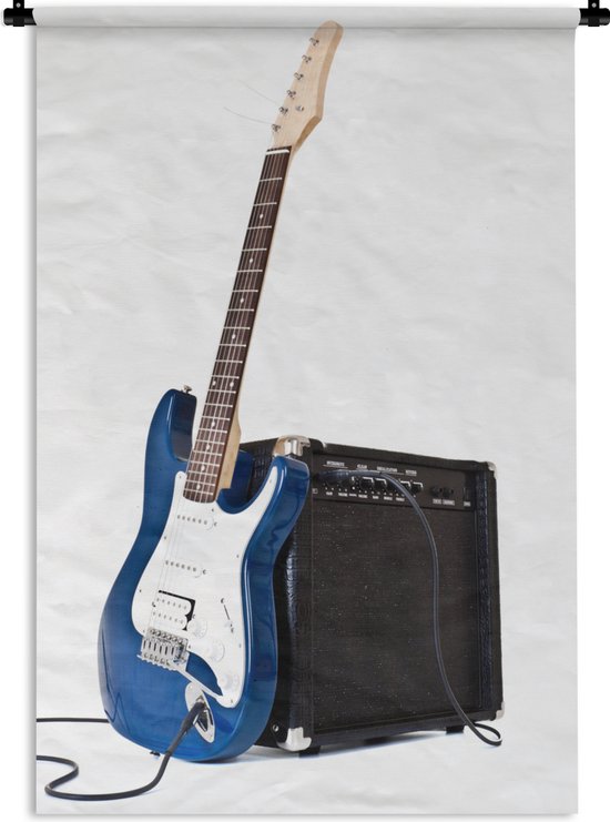 Wandkleed Elektrische gitaar - Een elektrische gitaar leunt tegen een versterker Wandkleed katoen 60x90 cm - Wandtapijt met foto