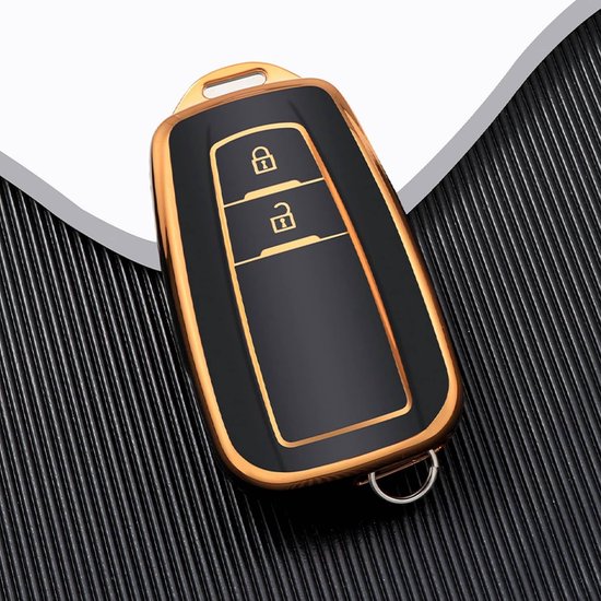 Zwart autosleutelhoesje met gouden rand en knoppen.