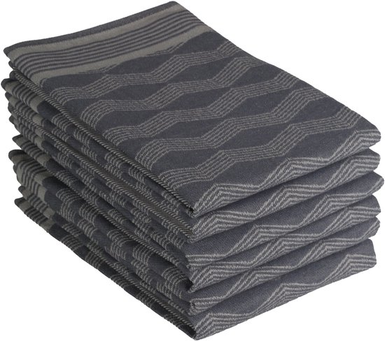 Pile de torchons gris foncé avec un subtil motif graphique en zigzag et des rayures horizontales en haut.