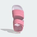 Roze Adilette sandalen voor kinderen met witte zool en geribbelde banden.