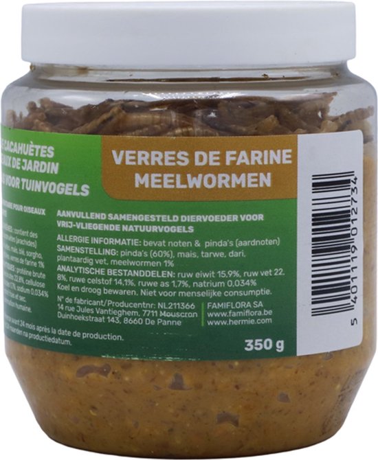 Glazen pot met vogelvoer, op de voorgrond gevuld met meelwormen.