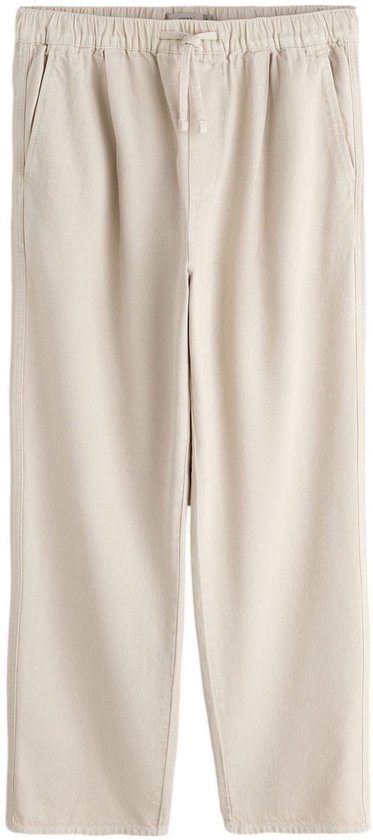Beige, ruimvallende joggingbroek met elastische taille en aantrekkoord.
