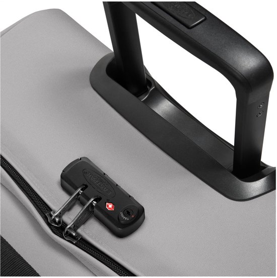 Detail van de TSA-combinatiesluiting op een grijze Eastpak koffer met handvat.