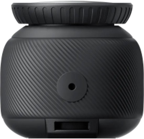 Zijaanzicht van de zwarte Insta360 GO 3S action camera met lensvatting en poort.
