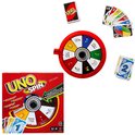 UNO Spin bordspel, rood spinwiel, stapels speelkaarten en losse kaarten op witte achtergrond.