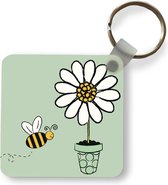 Porte-clés - Cadeaux à distribuer - Une illustration d'une abeille volant vers une fleur blanche - Plastique - Cadeaux de Sinterklaas - Cadeaux à distribuer pour les enfants - Cadeaux de chaussures - Petits cadeaux