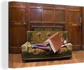 Canvas Schilderij Een slapende vrouw met een boek als deken - 120x80 cm - Wanddecoratie