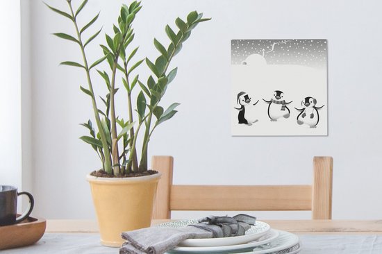 Tableau sur toile Une illustration de trois pingouins dans la neige - noir et blanc - 20x20 cm - Décoration murale