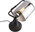 Lampe de banquier noire avec un abat-jour cylindrique en verre gris.