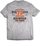 73 Jaar Legend - Feest kado T-Shirt Heren / Dames - Antraciet Grijs / Oranje - Perfect Verjaardag Cadeau Shirt - grappige Spreuken, Zinnen en Teksten. Maat M