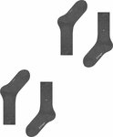 Twee paar donkergrijze Burlington sokken, elk met een subtiel logo. Eén paar is opgerold.
