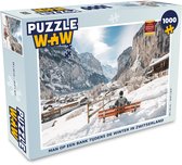 Puzzel Man op een bank tijdens de winter in Zwitserland - Legpuzzel - Puzzel 1000 stukjes volwassenen