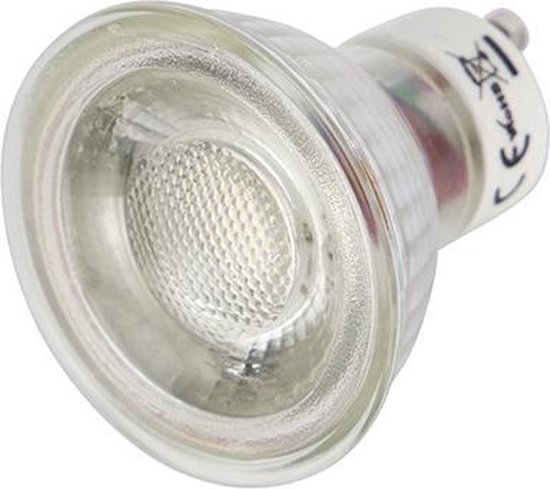 Gros plan d'une ampoule LED GU10 transparente avec un capuchon en verre et une base argentée.
