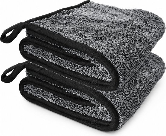 Deux lingettes microfibres gris foncé empilées avec bords et boucles noirs.