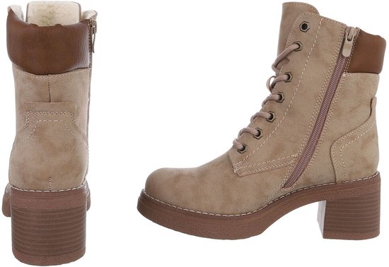 Beige veterlaarzen met bontvoering, ritssluiting, leren accenten en blokhak.