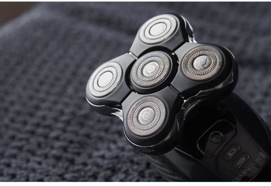 Zwarte Remington hoofdtrimmer met vijf roterende scheerkoppen, dichtbij gefotografeerd.