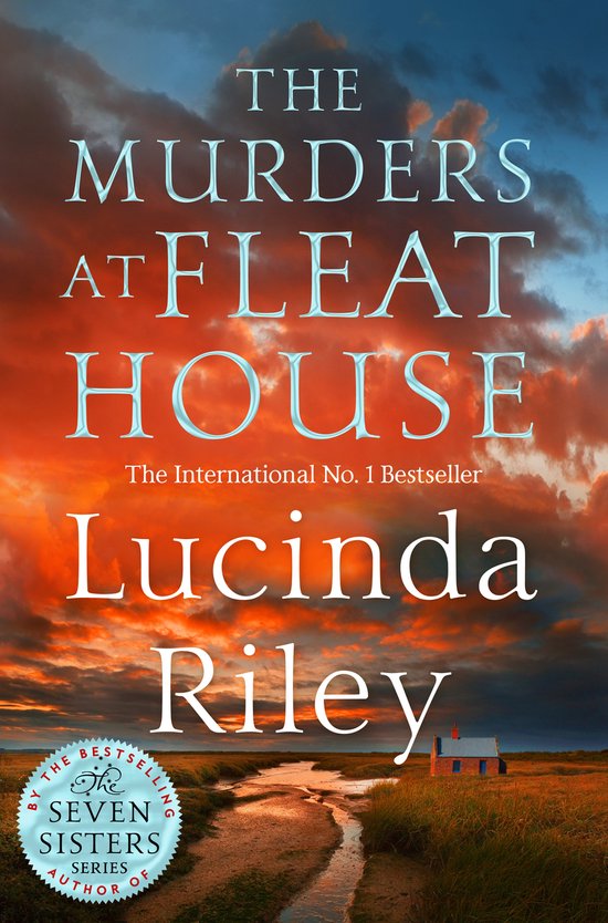 Boekcover met de titel 'The Murders at Fleat House' van Lucinda Riley, met een zonsondergang boven een klein huisje.