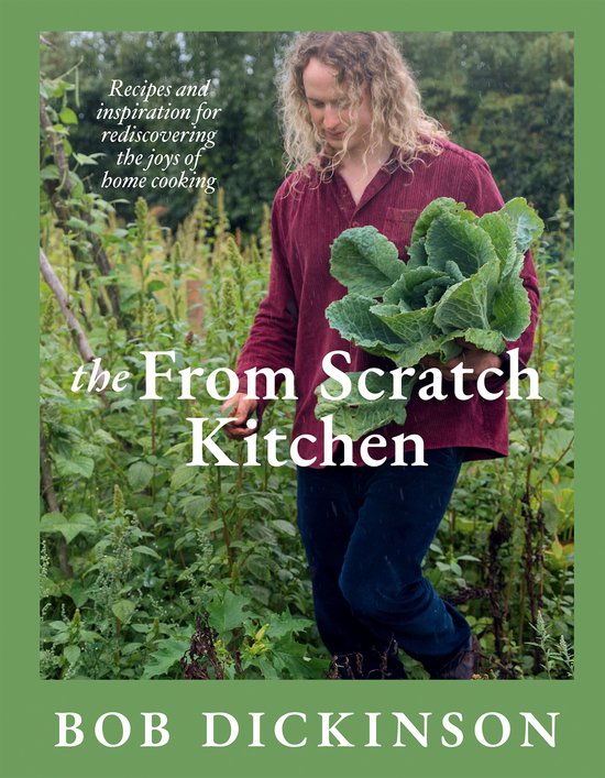 Een persoon met krullend blond haar in een bordeauxrode corduroy blouse en spijkerbroek, die een krop kool vasthoudt in een tuin. De tekst "the From Scratch Kitchen" en "BOB DICKINSON" is zichtbaar.