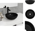 Lavabo noir en verre trempé, avec robinet noir.