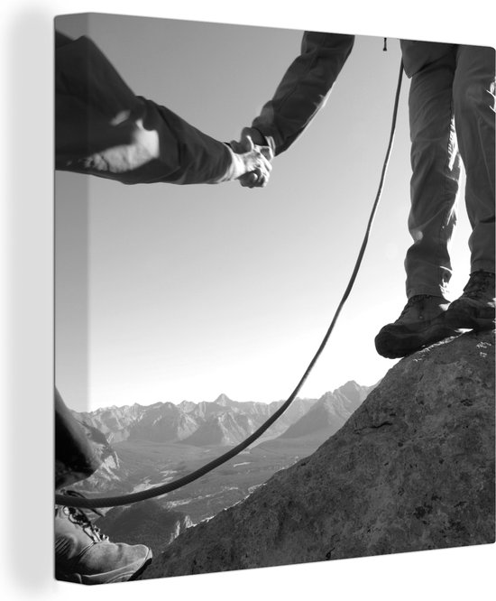 Canvas Schilderij Bergbeklimmers helpen elkaar - zwart wit - 50x50 cm - Wanddecoratie