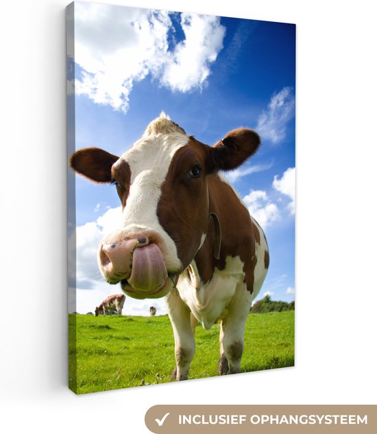 Vache qui sort la langue sur toile 80x120 cm - Tirage photo sur toile (Décoration murale salon / chambre) / Peintures sur toile Animaux