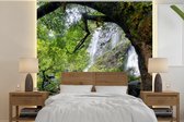 Behang - Fotobehang Veel begroeiing rond een steile waterval van het Klong Lan National Park - Breedte 280 cm x hoogte 280 cm