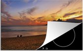 KitchenYeah® Inductie beschermer 78x52 cm - Het Zuid-Amerikaanse Ipanema-strand in Brazilië bij zonsondergang - Kookplaataccessoires - Afdekplaat voor kookplaat - Inductiebeschermer - Inductiemat - Inductieplaat mat