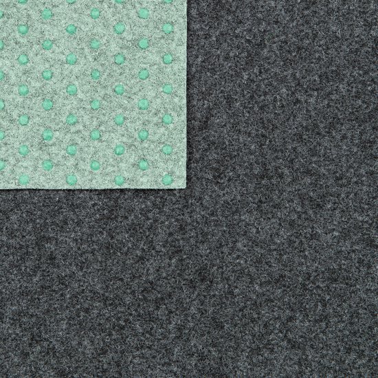 Dessous d'un tapis gris avec un motif antidérapant vert à pois