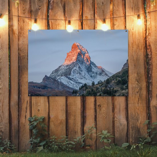 Tuinposter 120x80 cm - Tuindecoratie De Matterhorn in Zwitserland bij zonsopkomst - Poster voor in de tuin - Buiten decoratie - Schutting tuinschilderij - Tuindoek muurdecoratie - Wanddecoratie balkondoek