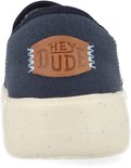 Arrière d'un mocassin HEYDUDE bleu marine avec textile et semelle mouchetée.