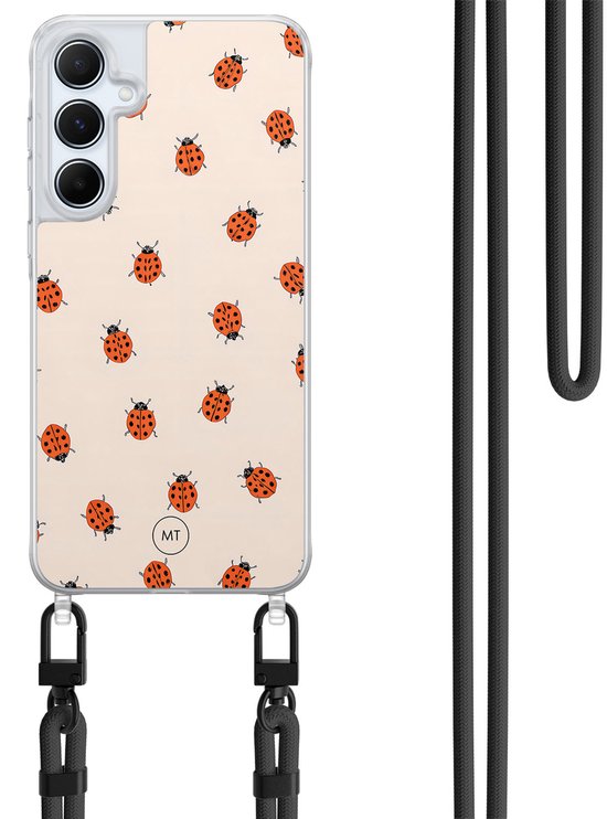 Coque de téléphone transparente avec fond crème et imprimé coccinelles. Un cordon noir est attaché en bas.