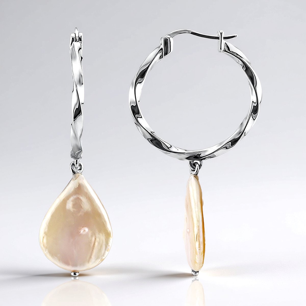 Cavill - Zilveren Oorbellen met Perzikkleurige Zoetwaterparels - 925 Sterling Zilver - Elegante Druppelvorm - Vrouwelijke Zilveren Sieraden