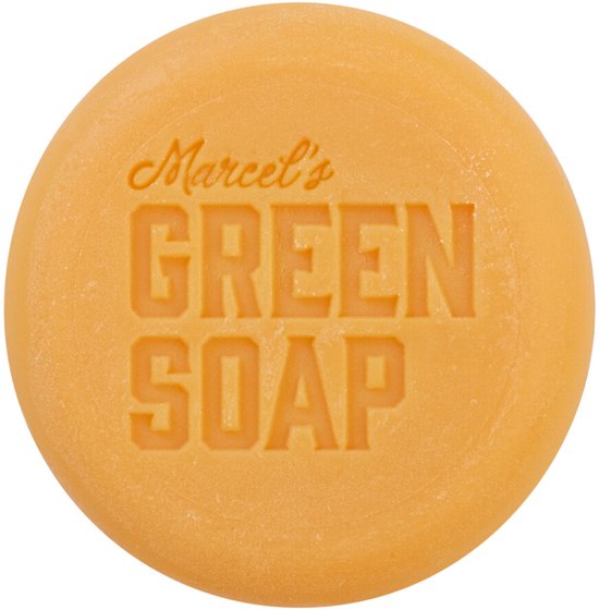Een ronde, oranje zeep met de tekst "Marcel's GREEN SOAP" in reliëf.