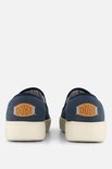 Vue arrière de deux mocassins HEYDUDE bleus avec semelles blanches et le logo 'HEY DUDE'.