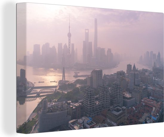 Canvas schilderij 140x90 cm - Wanddecoratie De zonsopgang boven de Bund en Shanghai in China - Muurdecoratie woonkamer - Slaapkamer decoratie - Kamer accessoires - Schilderijen
