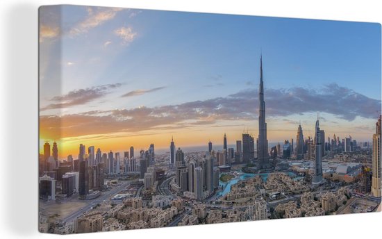 Canvas Schilderij Kleurrijke lucht boven Dubai en de Burj Khalifa - 120x80 cm - Wanddecoratie