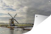 Tuinposter - Tuindoek - Tuinposters buiten - Winters landschap met een windmolen aan het water - 120x80 cm - Tuin