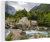Tableau sur toile Eau pétillante parmi les anciennes pierres albanaises à Theth - 150x100 cm - Décoration murale