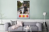 Canvas Schilderij Rottweiler-puppy naast een volwassen rottweiler - 80x120 cm - Wanddecoratie