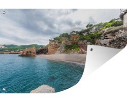 Muurdecoratie Strand met rotsen bij Costa Brava - 180x120 cm - Tuinposter - Tuindoek - Buitenposter