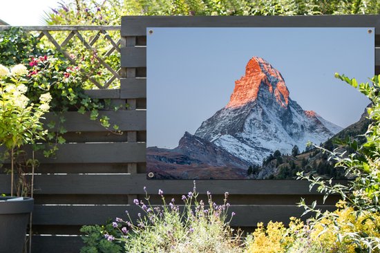 Tuinposter 120x80 cm - Tuindecoratie De Matterhorn in Zwitserland bij zonsopkomst - Poster voor in de tuin - Buiten decoratie - Schutting tuinschilderij - Tuindoek muurdecoratie - Wanddecoratie balkondoek